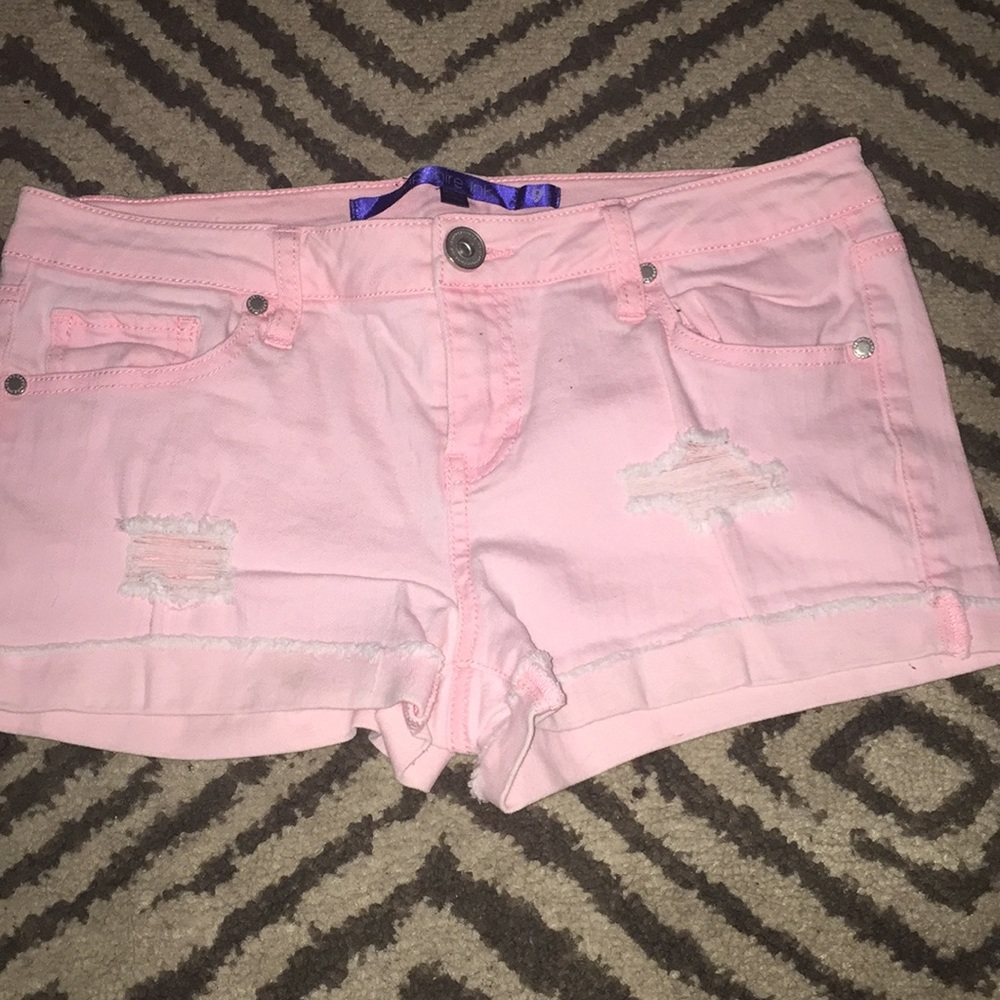 Pink ripped shorts